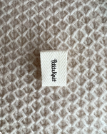 "PetiteKnit"- brettet label